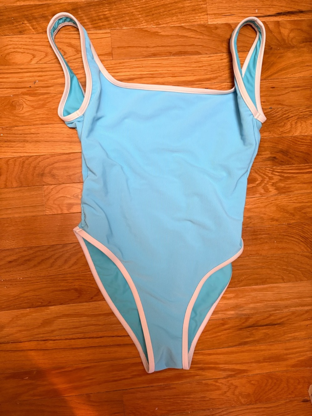 Light Blue One-Piece Swimsuit with White Trim